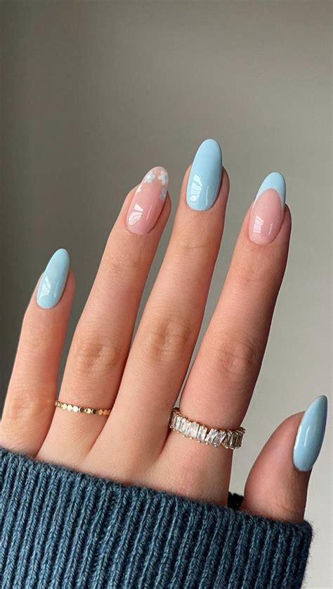 Next, use a French tip guide or a steady hand to paint the tips blue. Make sure to use a high-quality polish and apply at least two coats for a vibrant color. Allow the polish to dry completely before removing the guide. If you make any mistakes, use a small brush dipped in nail polish remover to clean up the edges.